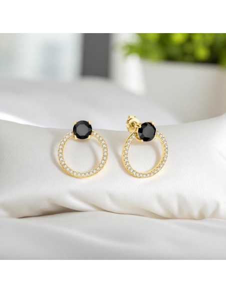 Boucles d’oreilles STARDUST dorées avec cristaux noirs Swarovski® sur fond coloré